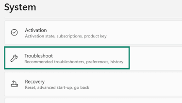 Windows System settings page with Troubleshoot highlighted.