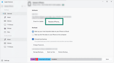 macOS Finder's iPhone screen with the Restore iPhone button in focus.